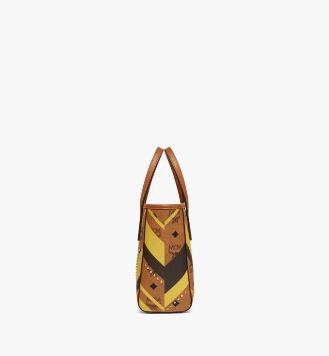 Bolso de compras Toni Shopper con cremallera superior y tachuelas en lona Visetos Mega Herringbone Bolso de compras Toni Shopper con cremallera superior y tachuelas en lona Visetos Mega Herringbone