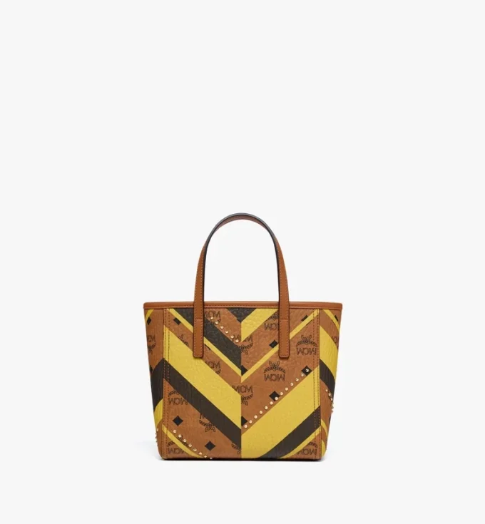 Bolso de compras Toni Shopper con cremallera superior y tachuelas en lona Visetos Mega Herringbone Bolso de compras Toni Shopper con cremallera superior y tachuelas en lona Visetos Mega Herringbone