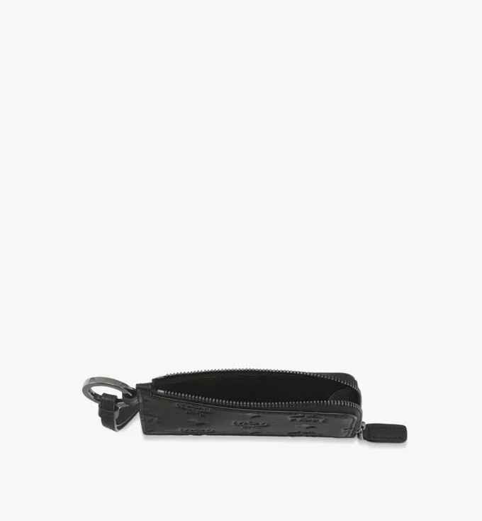 Neceser Aren en piel con monograma en relieve Neceser Aren en piel con monograma en relieve