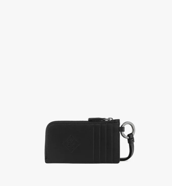 Neceser Aren en piel con monograma en relieve Neceser Aren en piel con monograma en relieve
